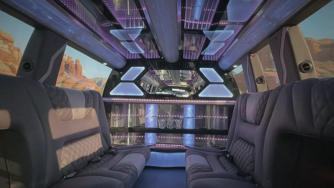 Inside the Cadillac Escalade limo in Woody Creek Colorado: LED light-show ceiling, leather lounge seating and lit bar
